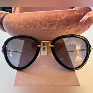 Miu Miu 03QS Aviator Sunglasses.
